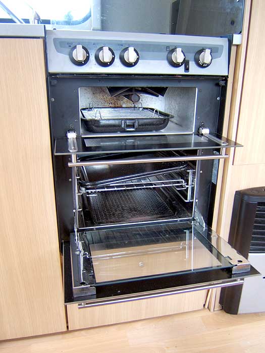 The dual fuel hob with 3 gas burners and an electric hotplate.